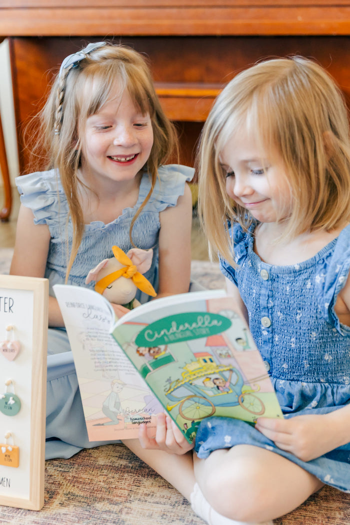 Girls reading the bilingual Cinderella story