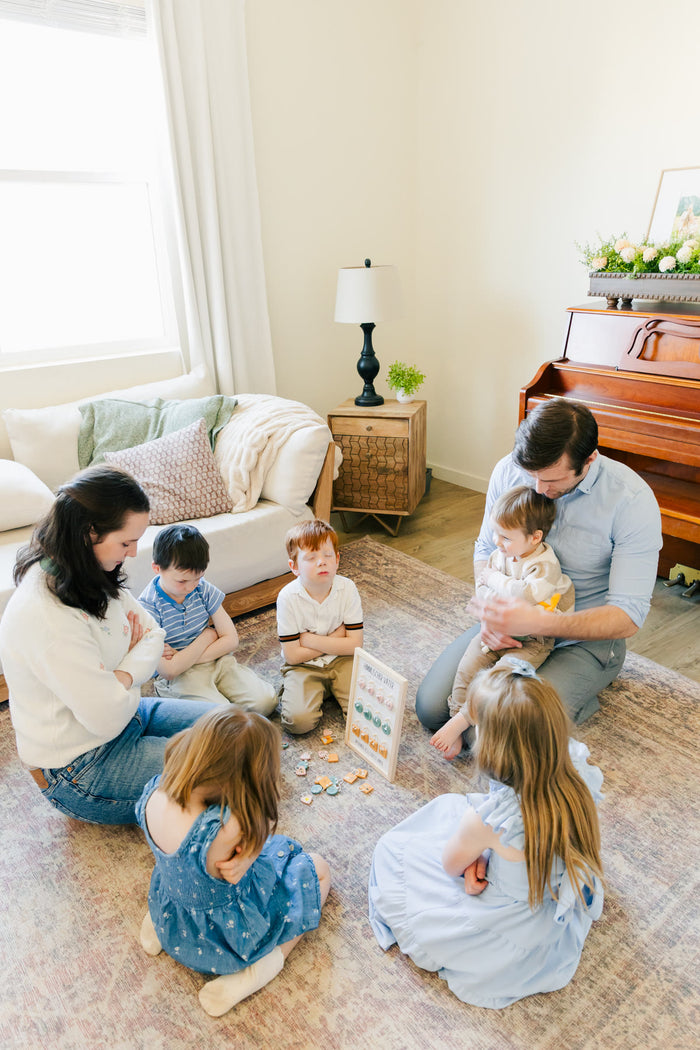 Family gathered in a circle for prayer