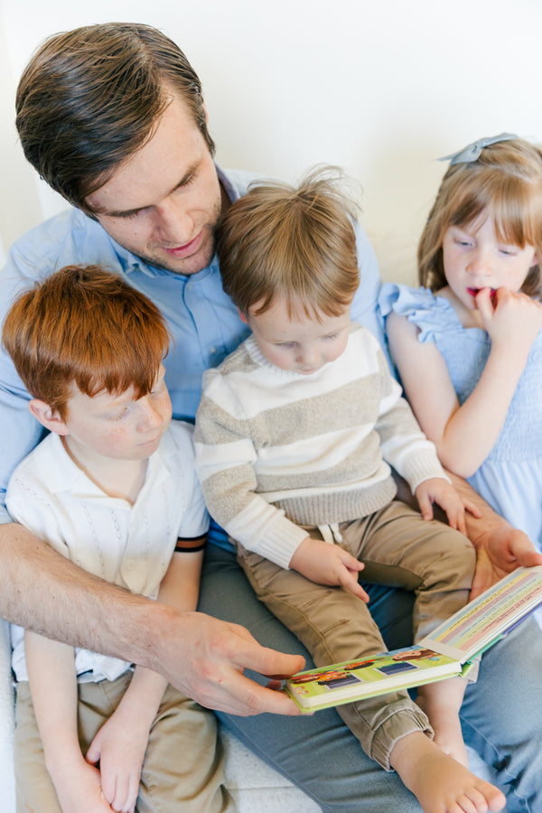 Dad gathering the kids for prayer